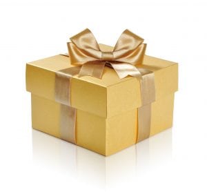 Golden gift box with golden ribbon over white background. Clipping path included.